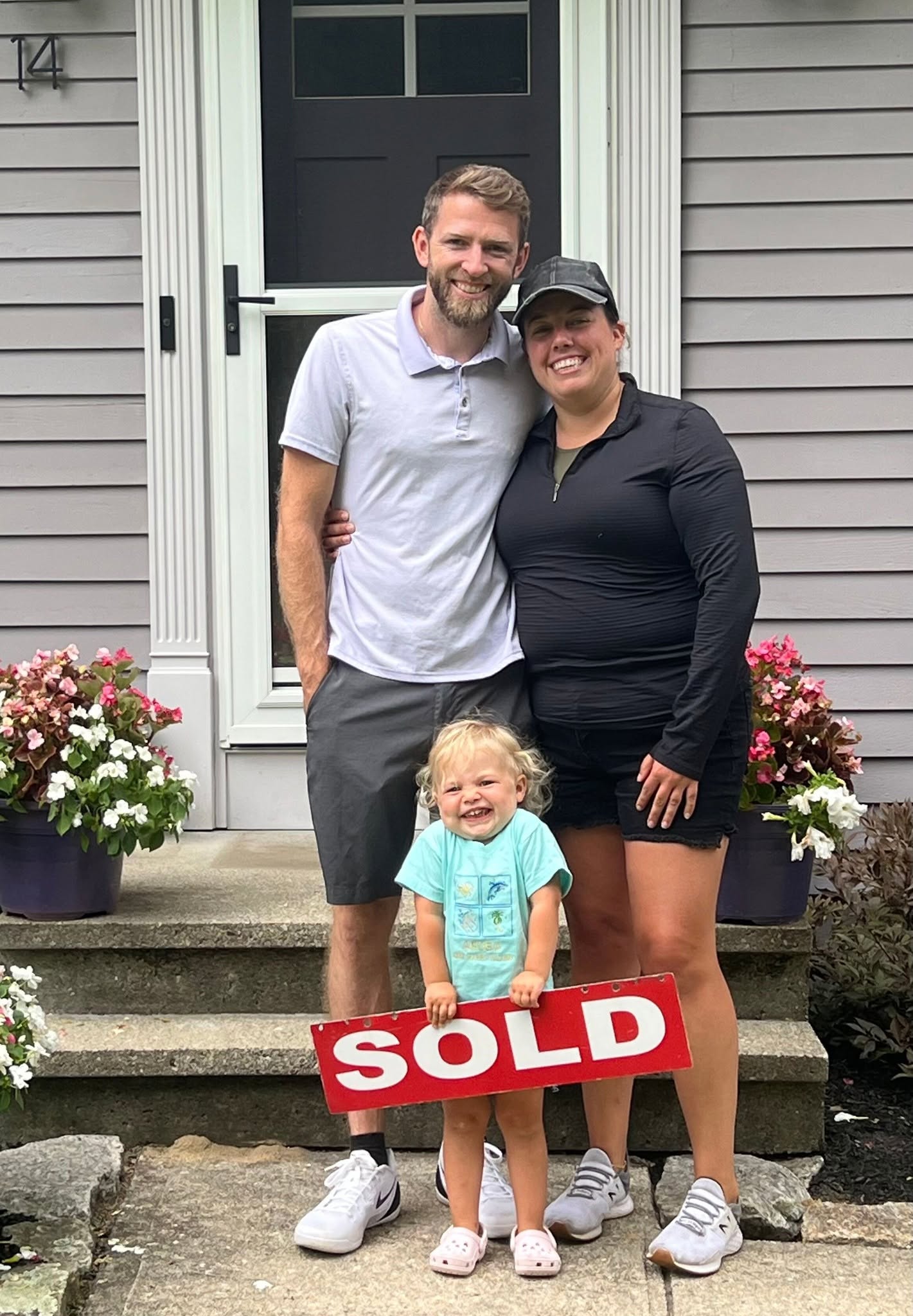 Family in front of new home